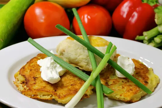 Crispy potato latke with sour cream and scallion