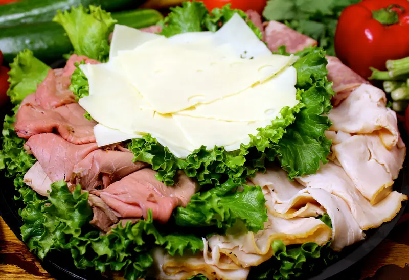 Platter of sliced roast beef, turkey and cheese